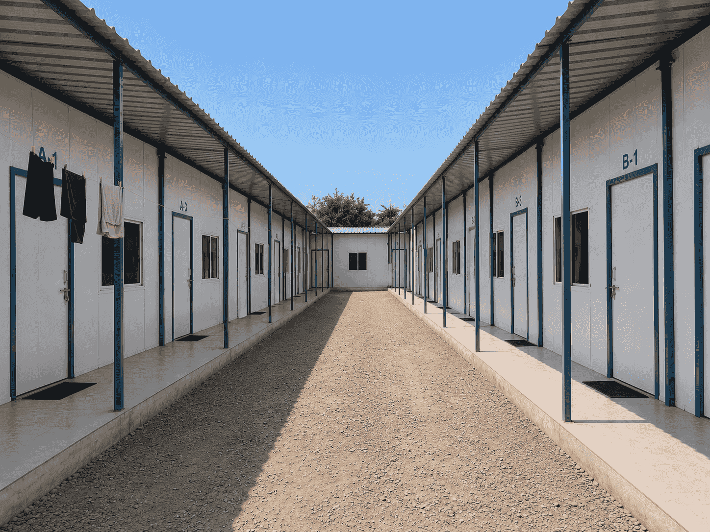 Rows of prefab labour accommodation blocks at a project site