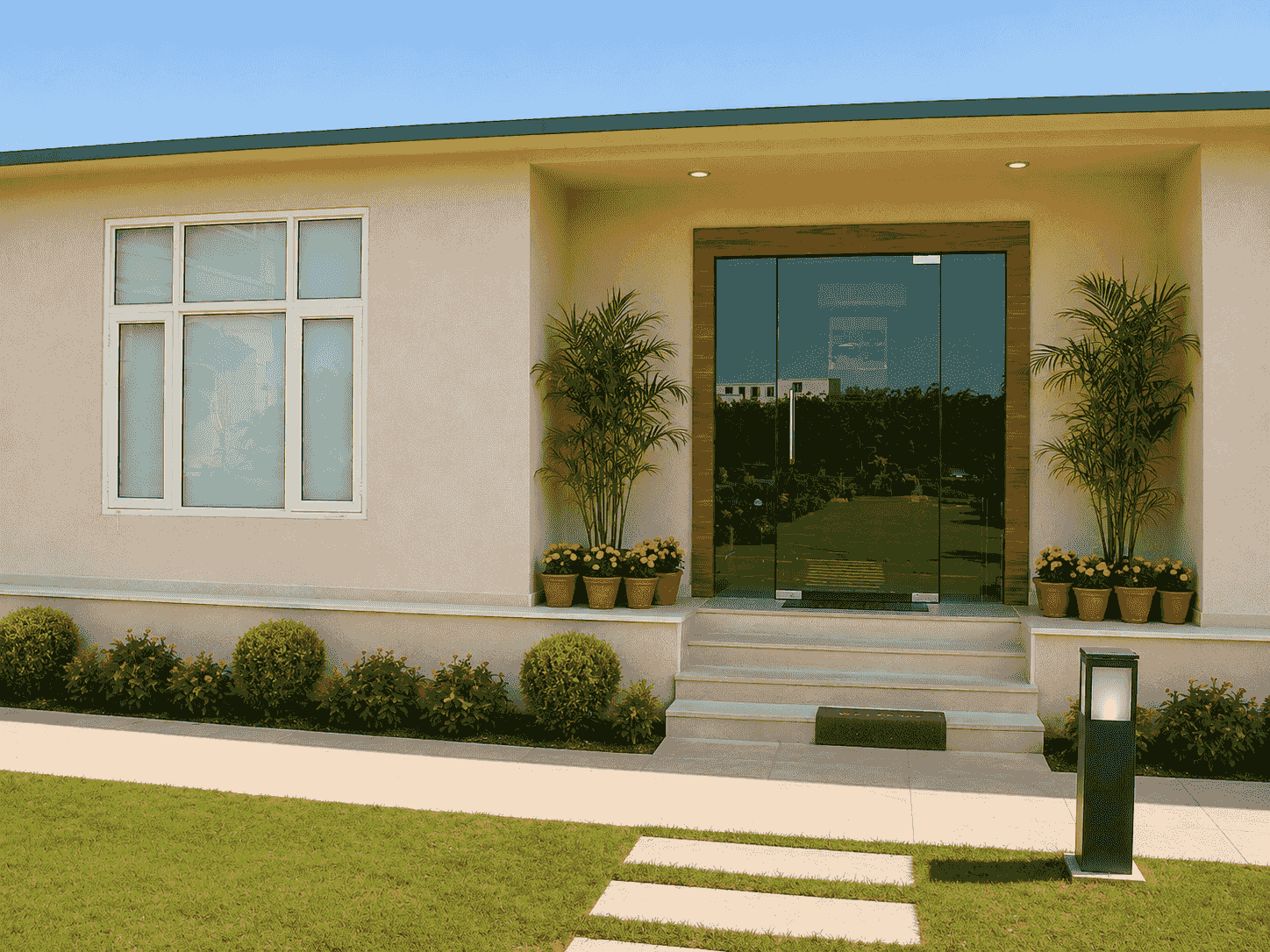 Completed prefab farmhouse with verandah and landscaping