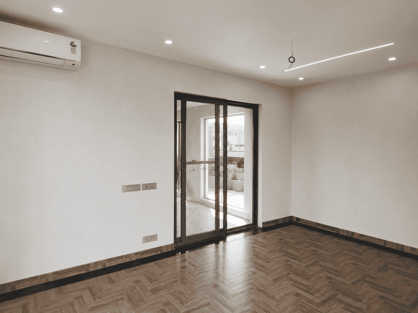 Interior of an insulated rooftop prefab room with sliding door